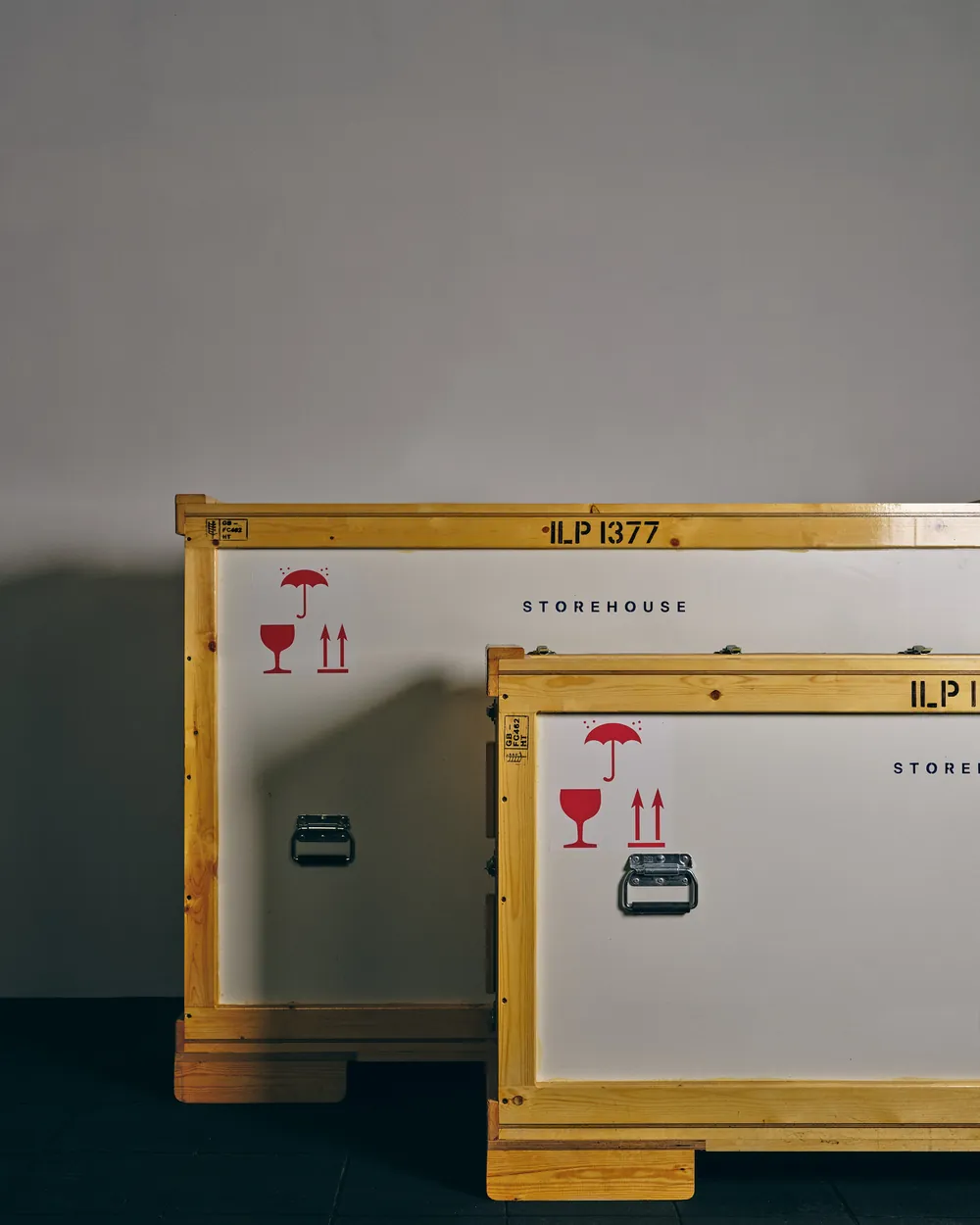 Two marked Storehouse crates standing on their bearers inside the facility.